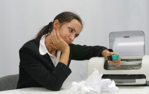 Business woman is printing in office, copy, duplicate, calling